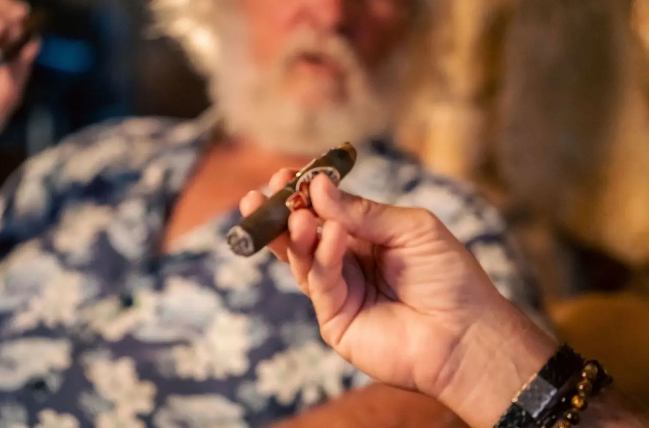 Hand holding a cigar